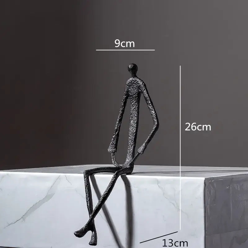 Black textured metal human sculpture with elongated limbs abstract metal human decorbites living room decor