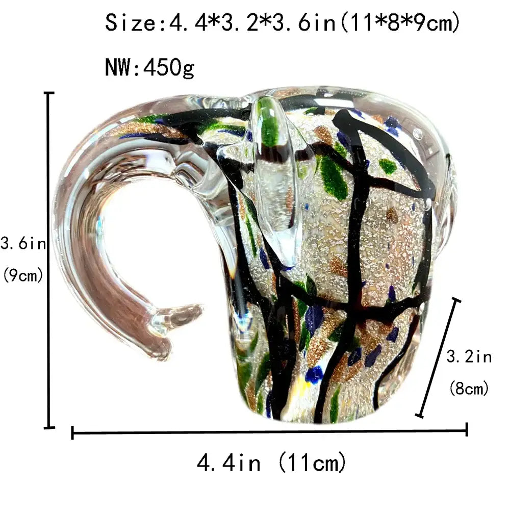 A decorbites elephant crystal glass sculpture with clear body black lines and green blue gold speckles for living room decor