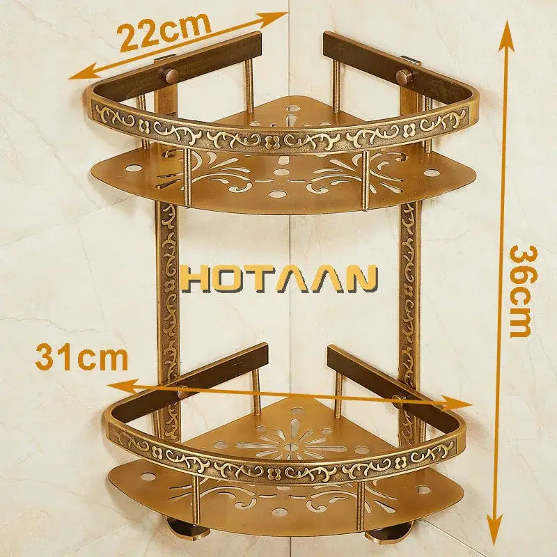 Antique brass double layer corner shelf bathroom ornate storage rack with floral cutout patterns and rounded edges by DecorBites