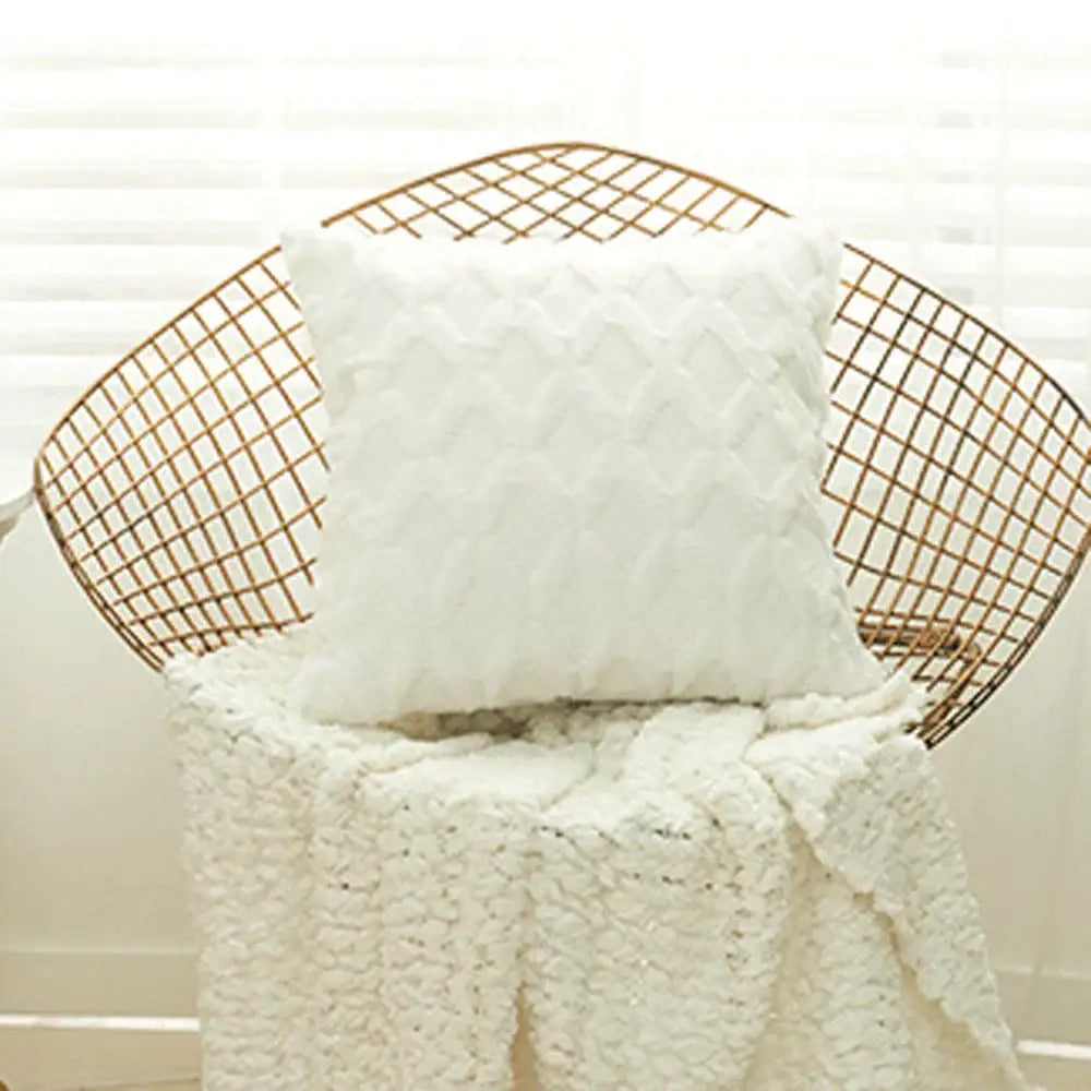 White plush cushion cover with textured quilted geometric diamond pattern for living room decor