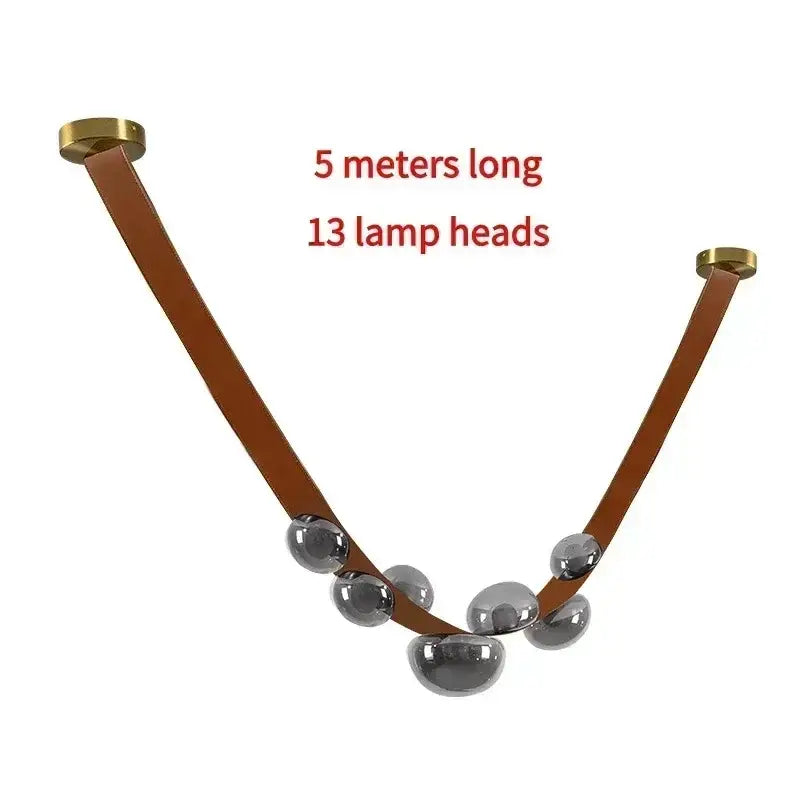 Black leather and glass pendant light with 13 silver spherical light sources as a dining room focal point