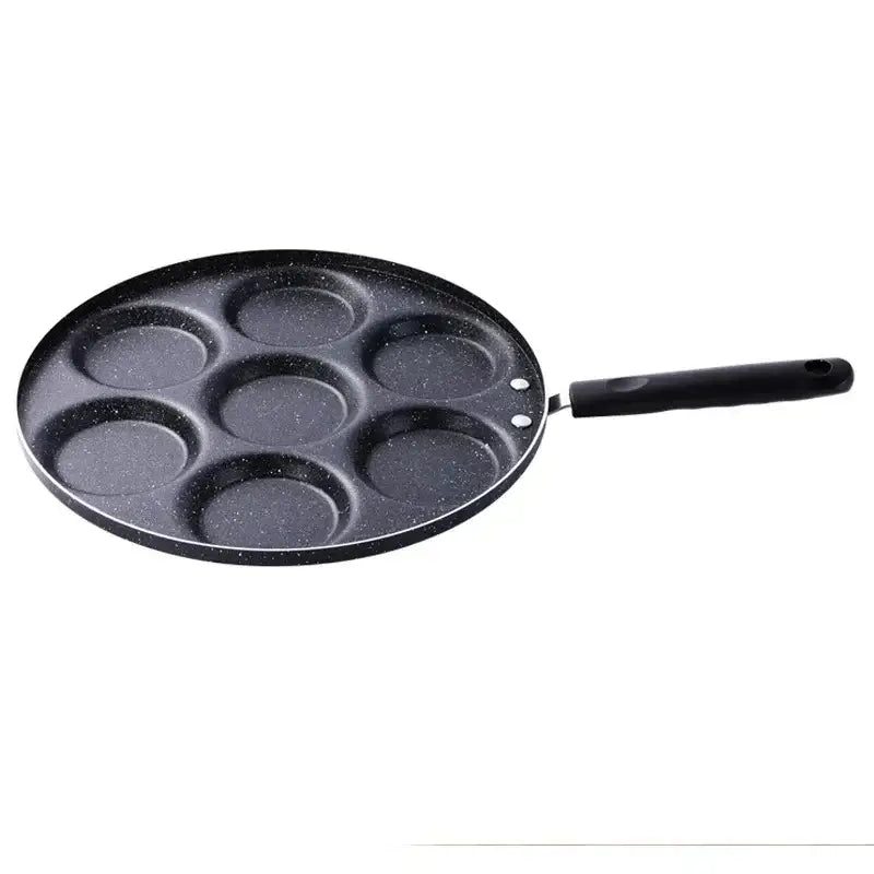 Black speckled non-stick breakfast egg pan with seven circular sections and handle for decorbites breakfast egg cooking