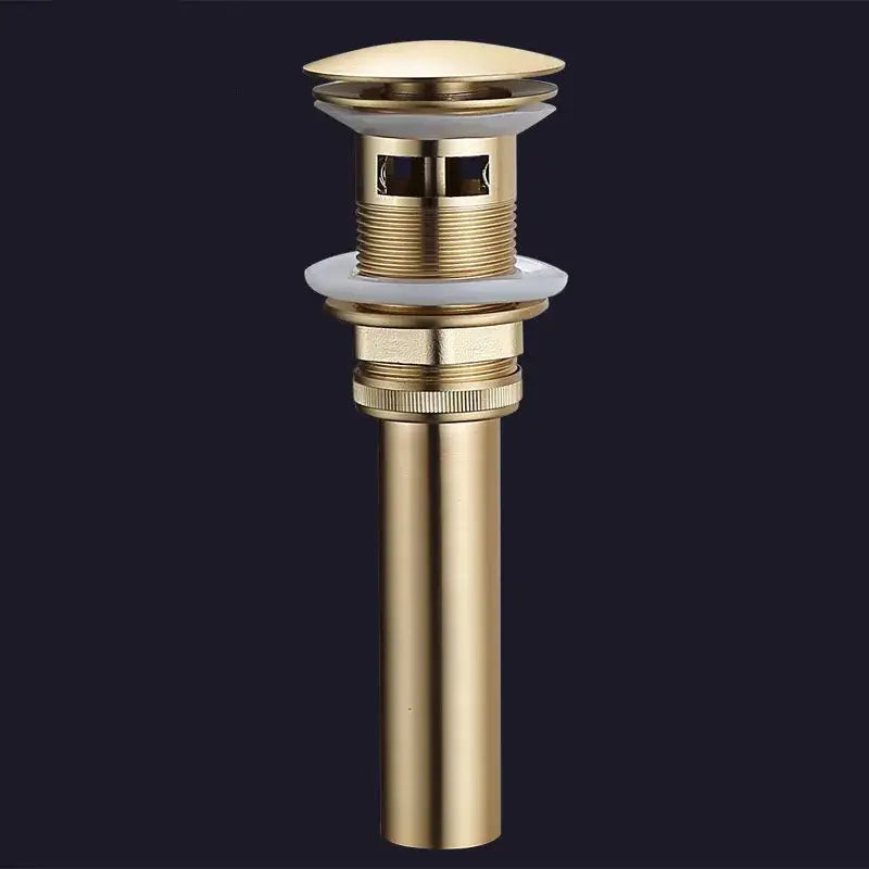 Brushed gold and white ceramic bathroom sink drain assembly kit featuring a sleek gold brass drain assembly with ceramic stopper