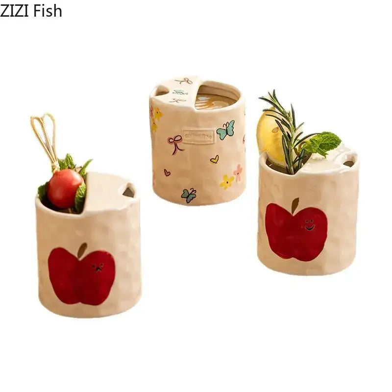 Cream-colored cartoon pattern porcelain toothbrush holder with red apple decals and floral designs and handle for bathroom decor