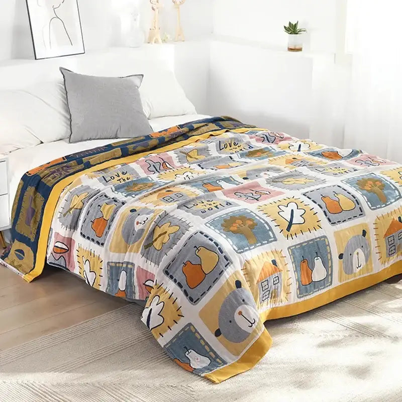 A cozy decorbites cartoon throw blanket with a multicolored patchwork of cartoon animals in yellow and gray pastels