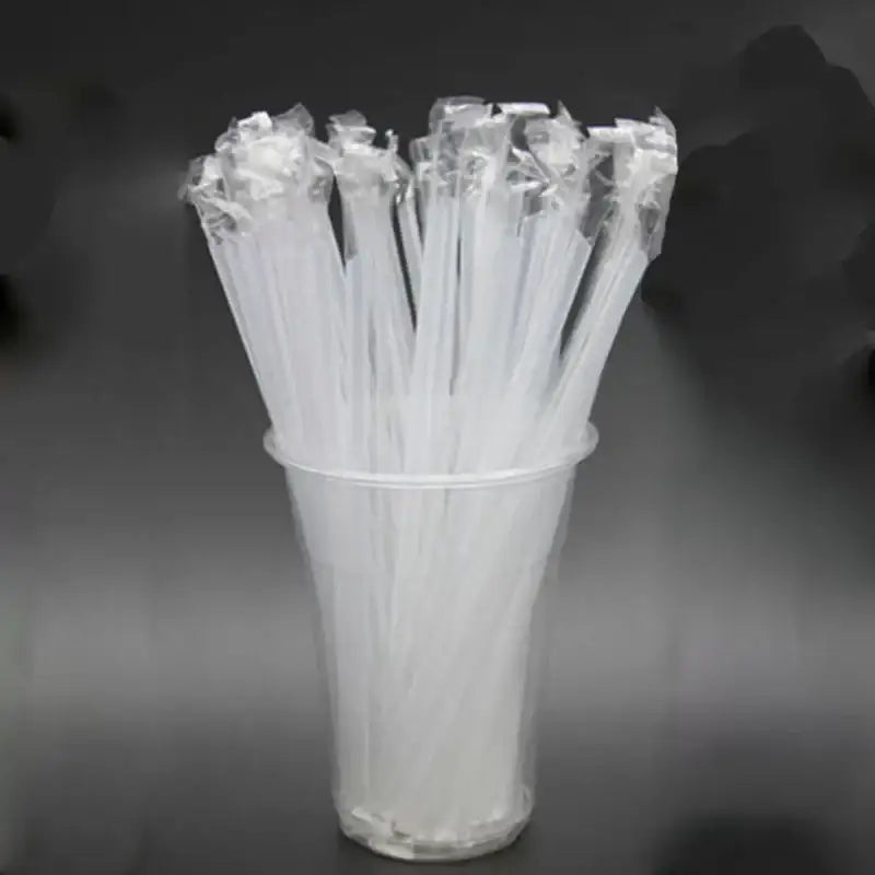 A clear plastic cup filled with decorbites clear individually wrapped drinking straws in transparent packaging