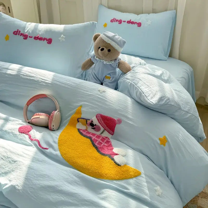 Light blue soft bedding set with plush teddy bear in pajamas and decorbites cartoon embroidery bed accents