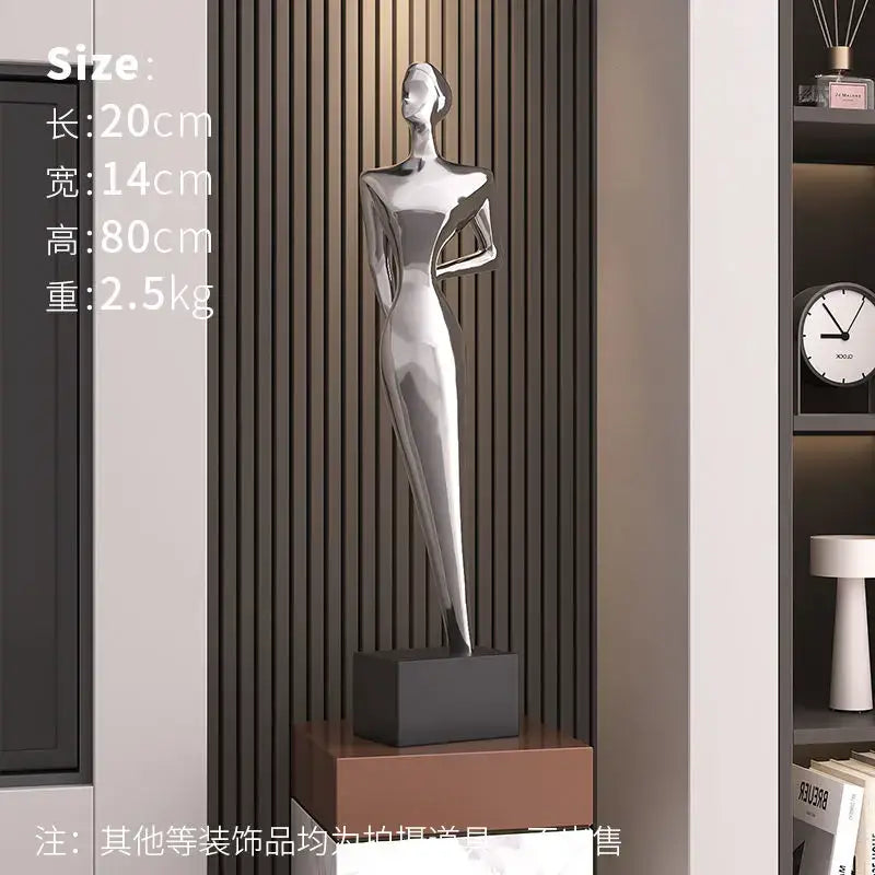A sleek silver-toned decorbites abstract figure art sculpture with glossy metallic finish for luxury living room decor