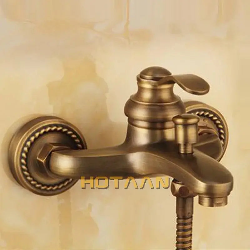 Decorbites™ antique brass wall mount shower head kit with ornate rope detailing and classic curved spout faucet