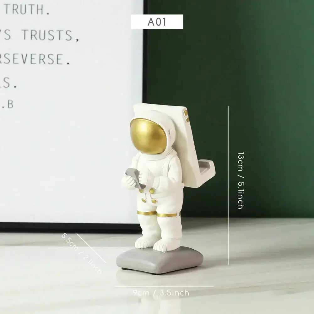 Decorbites astronaut figurine abstract sculpture in white with gold accents standing on a gray base for modern decor