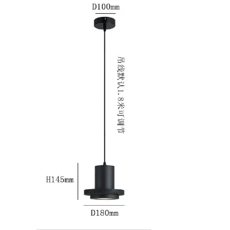 Black cylindrical pendant light with matte finish and adjustable cord in decorbites black hole stone chandelier design
