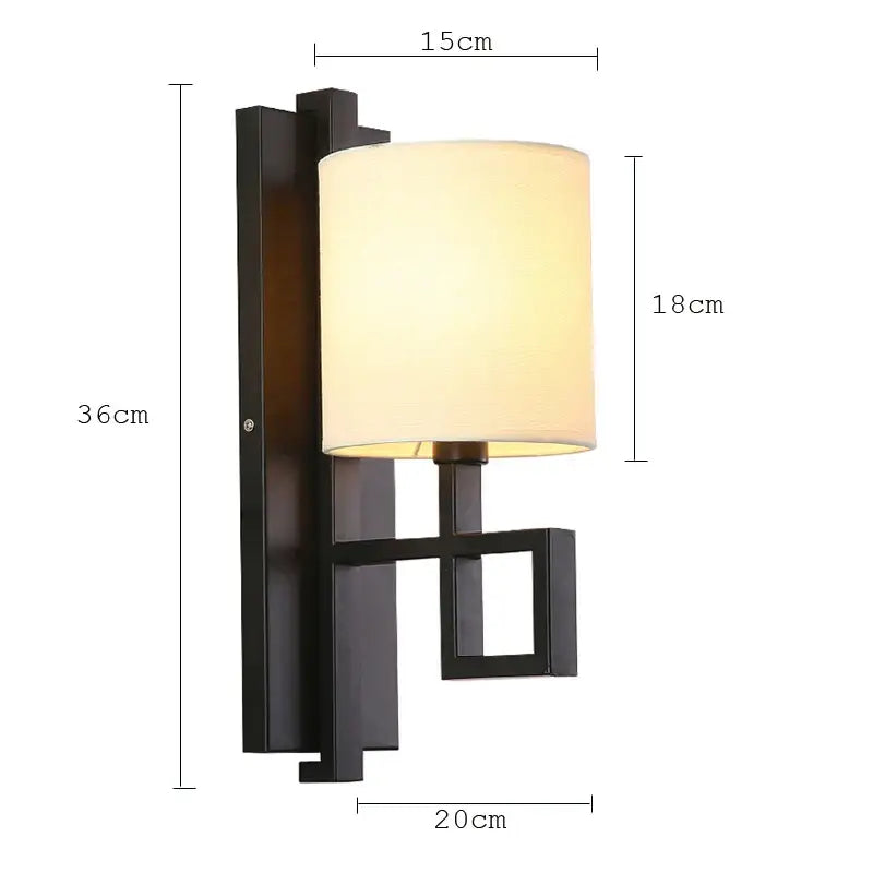Black metal wall lamp with cylindrical off-white fabric shade in DecorBites style cloth wall lamp for bedroom and porch