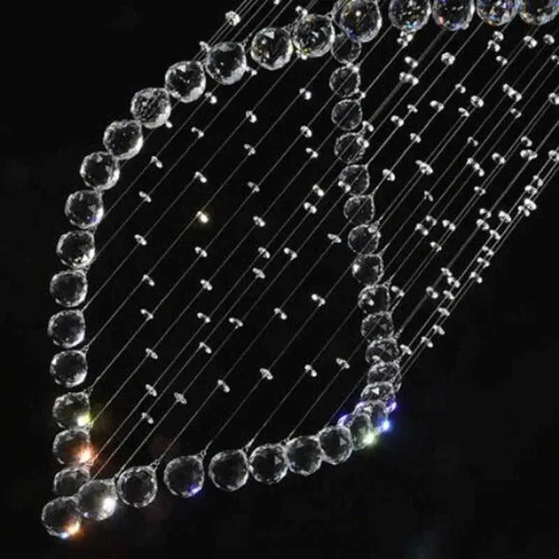A decorbites crystal chandelier featuring clear faceted beads strung on thin wires for villa hall stairs lighting