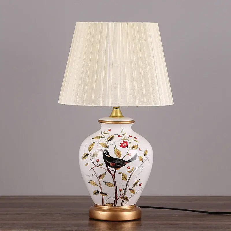 Decorbites led ceramic table lamp with white base, hand-painted black bird and floral design, off-white pleated shade
