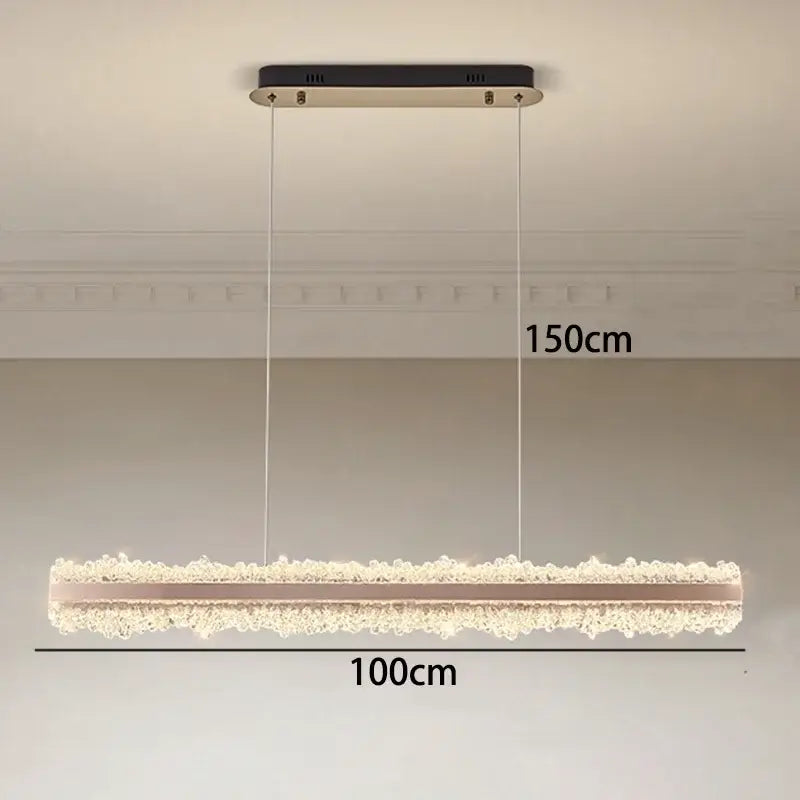 A modern decorbites led indoor rectangular chandelier with black and gold fixture and cascading clear beads for bedroom lighting