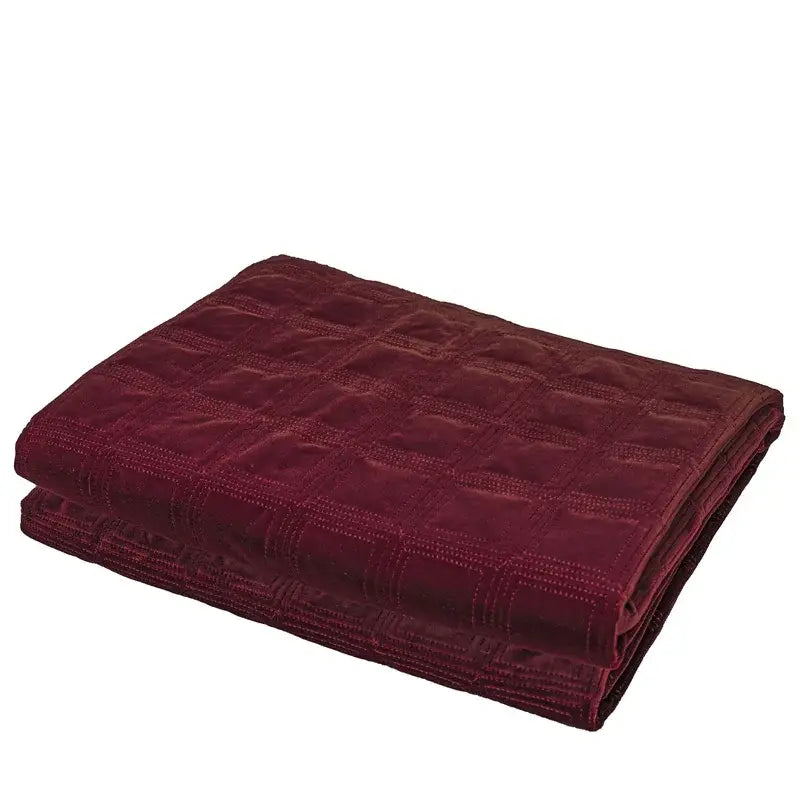A plush deep burgundy velvet throw blanket with a quilted grid pattern complements decorbites luxe linen blend cushion covers
