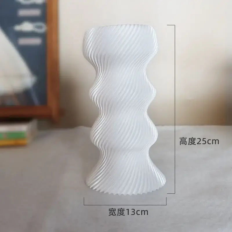 A sleek white ceramic decorbites elegant high-end vase with modern wavy ribbed design for living room decor