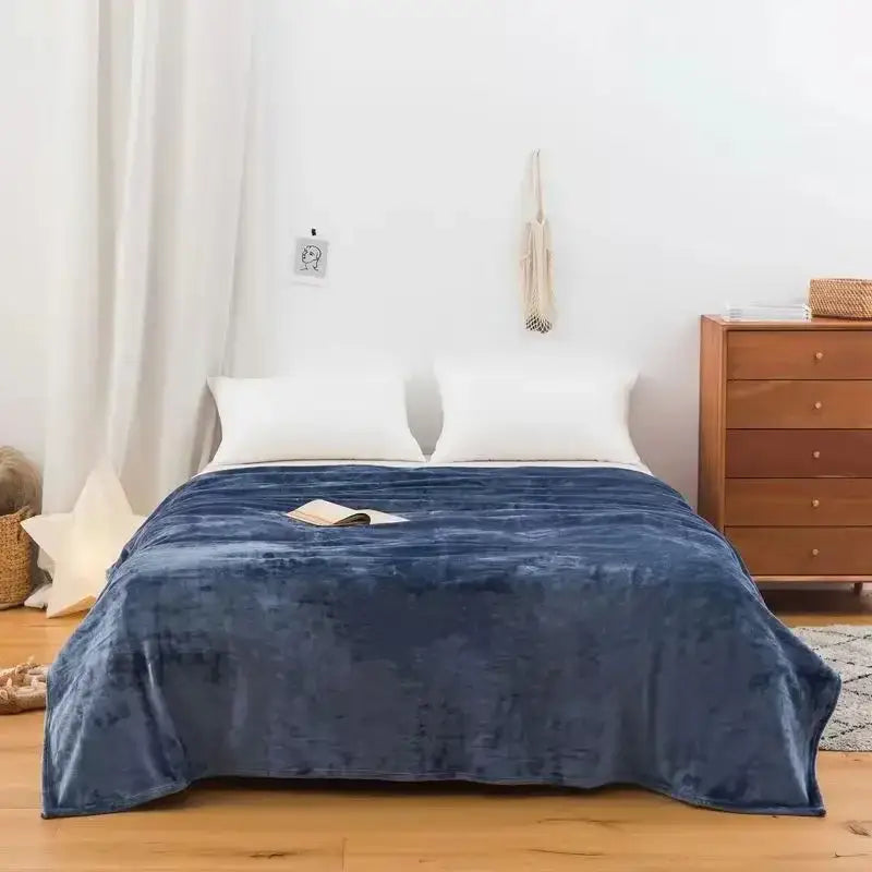 Deep blue plush throw blanket with soft velvety texture made of coral fleece flannel for decorbites bedroom decor