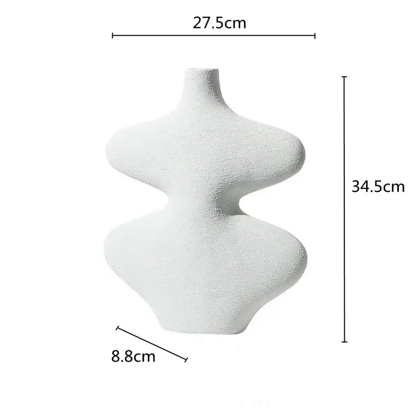 A sleek white geometric ceramic vase with textured surface from decorbites ceramic vase set for living room decor