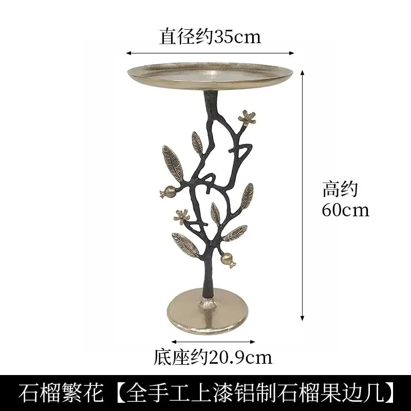 Golden brass bird tree side table with decorative brass bird base featuring leaves and pomegranates for living room decorbites brass bird
