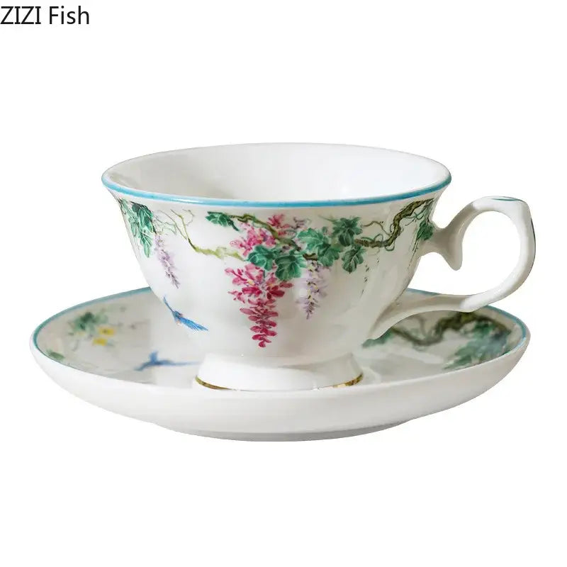 A delicate white vine flower porcelain cup and saucer with pink wisteria blossoms and blue birds from decorbites green vine