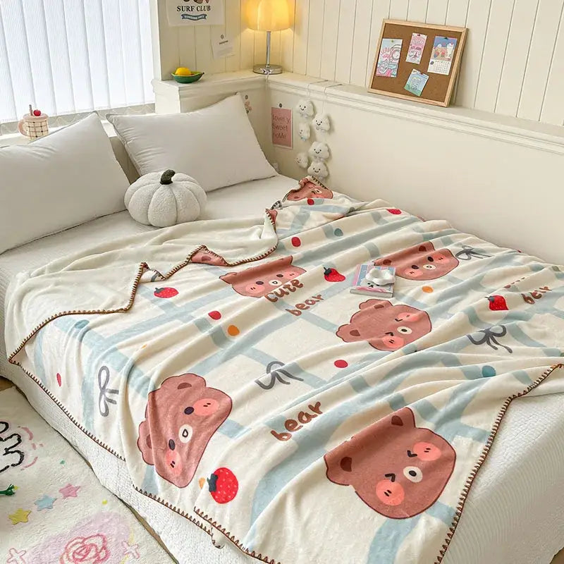 A light blue bear pattern cozy milk velvet blanket with cream fleece and playful pink bears for decorbites cozy milk use
