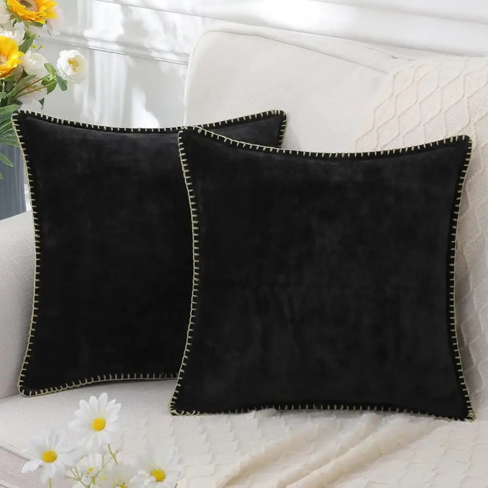 Black velvet square throw pillows with contrasting cream stitched edges complement decorbites blue chenille cushion covers