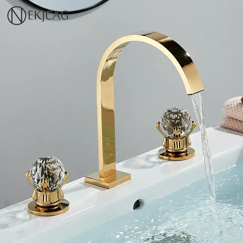 Luxury gold crystal handle basin faucet with decorbites crystal handles and a sleek arched spout for bathroom use
