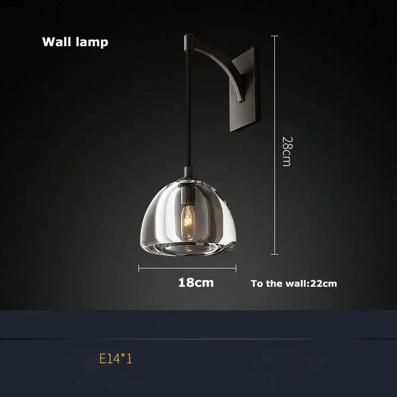 A sleek minimalist gold crystal chandelier lighting with clear glass dome and matte black bracket for dining room decorbites k9 crystal