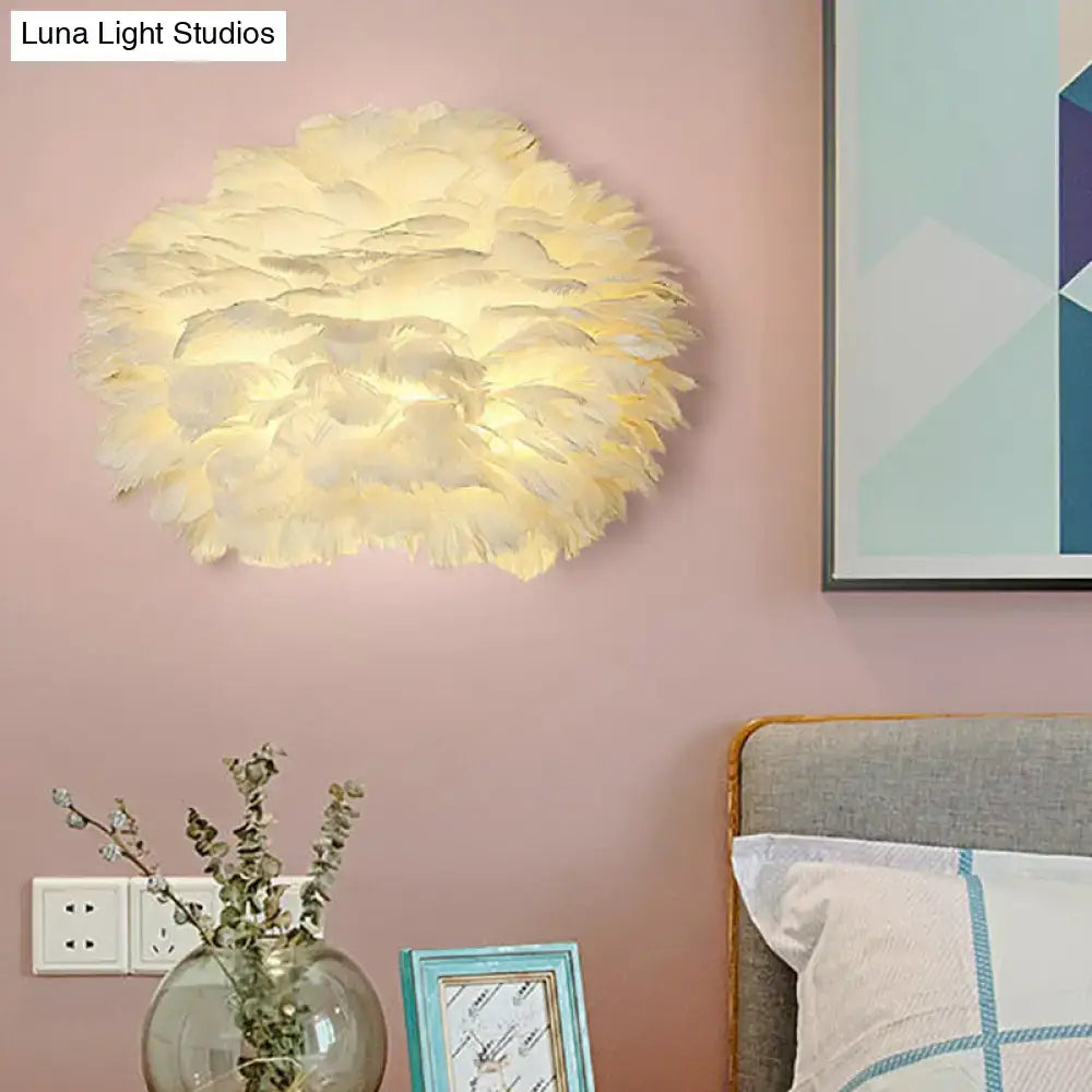Minimalist white feather floral wall sconce with a soft cream-colored fluffy cloud-like design for bedroom lighting