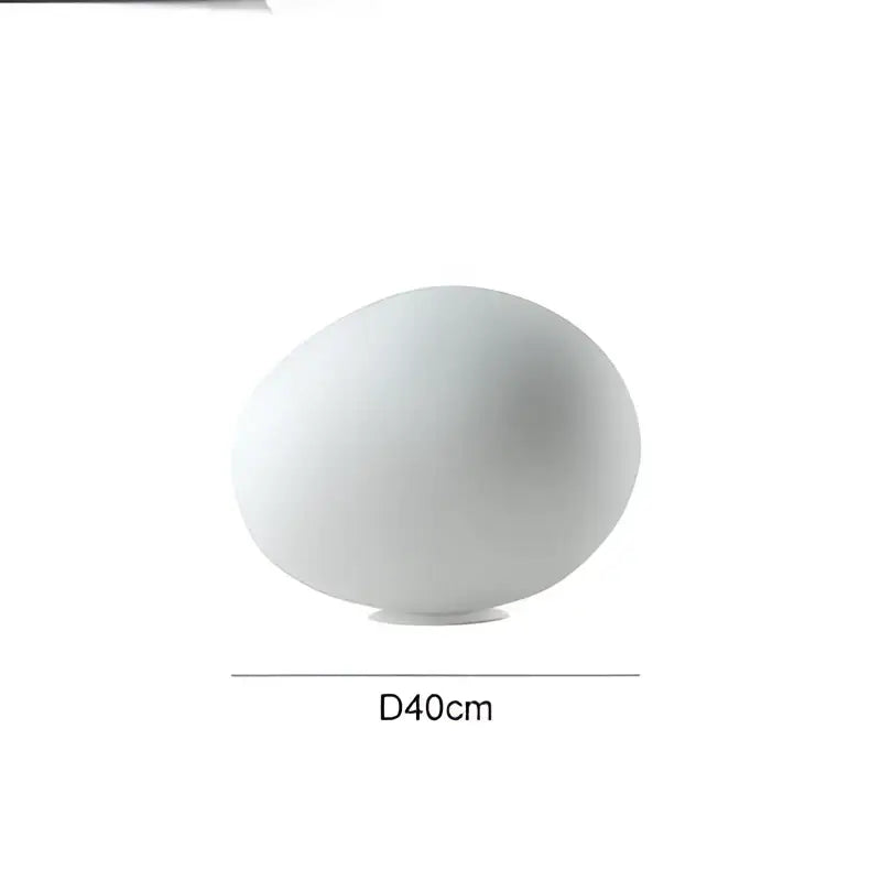 A sleek matte white decorbites goose egg led floor lamp with a 40cm diameter base for bedroom decor