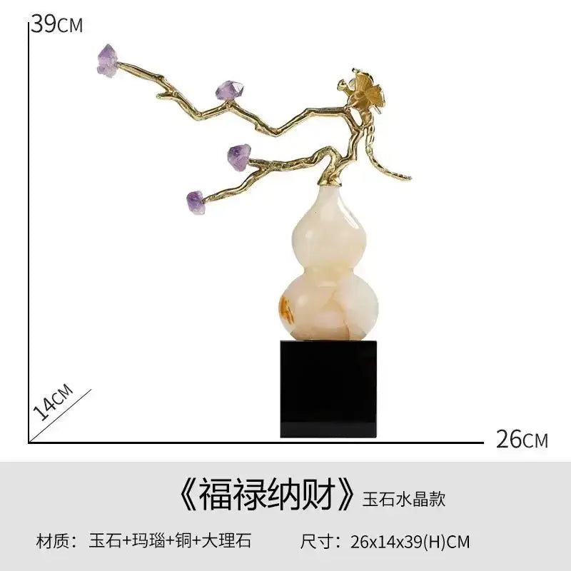 Delicate gold-toned branch sculpture with purple amethyst stones and golden flower on white decorbites crystal jade gourd base