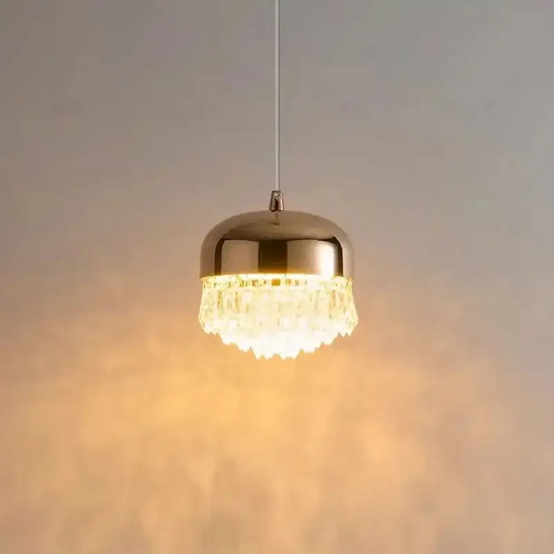 Modern black crystal tassel chandelier featuring a polished gold dome and clear crystal tassel droplets pendant light