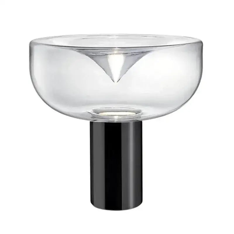 Modern clear glass aella table lamp with sleek black cylindrical base and triangular cutout for bedroom or office decorbites aella