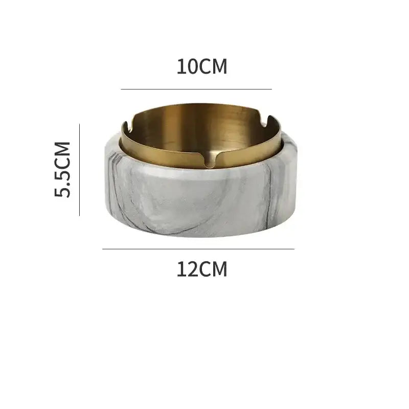 Modern gold plated marble texture ashtray with a marble effect and gold toned metal rim for living room decor by decorbites