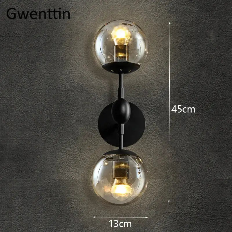 Black metal decorbites glass beans wall sconce with two clear smoked glass globe shades and exposed filament bulbs