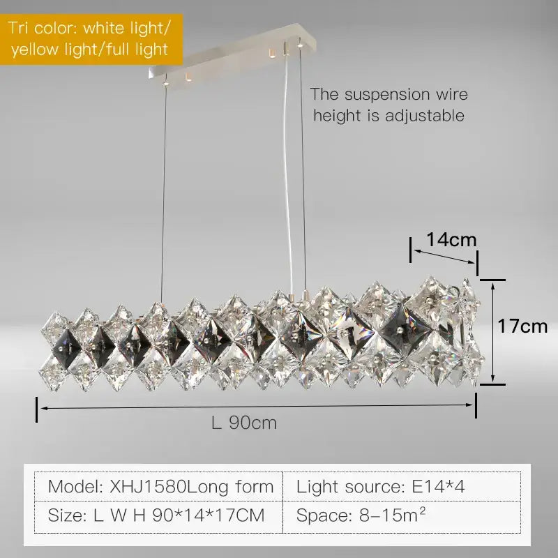 A modern elongated decorbites crystal chandelier with clear and smoky crystals and a sleek white metal frame