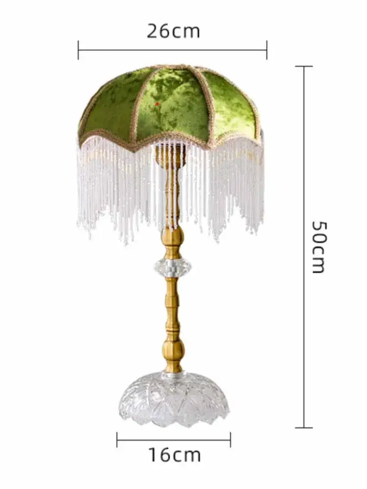 Elegant green velvet table lamp with gold lustre tassel trim on a gold bamboo stem for bedroom decorbites gold lustre