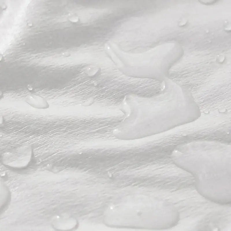 White baby elder hypoallergenic waterproof fitted sheet showing textured fabric with scattered water droplets
