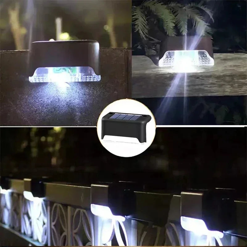 Black solar-powered pathway light with rectangular design and clear lens for outdoor garden and patio decor