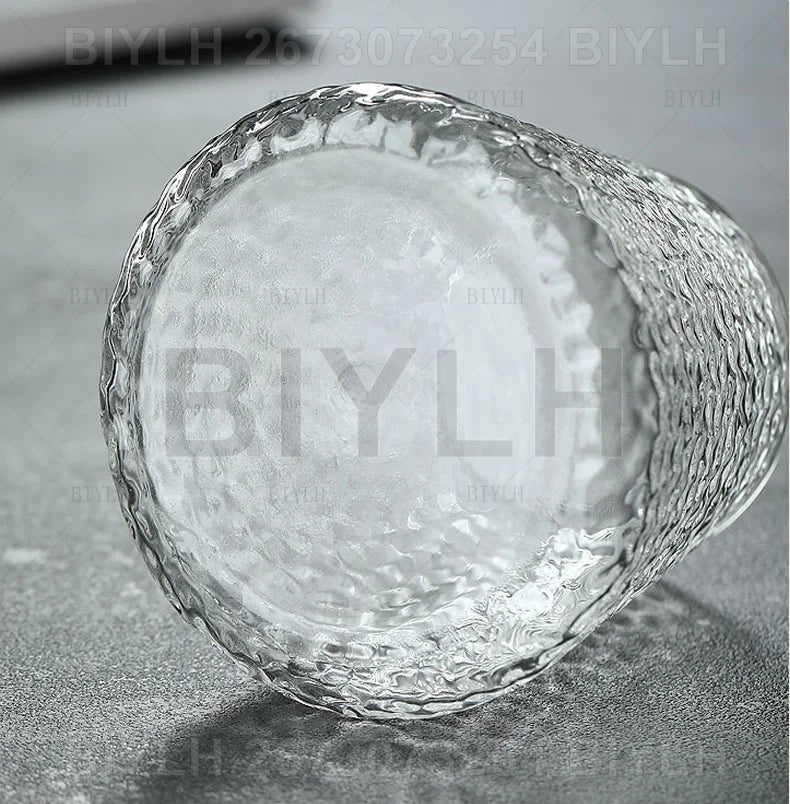 Clear glass tumbler with textured hammered finish part of transparent hydroponic plant flower pots with base tray set