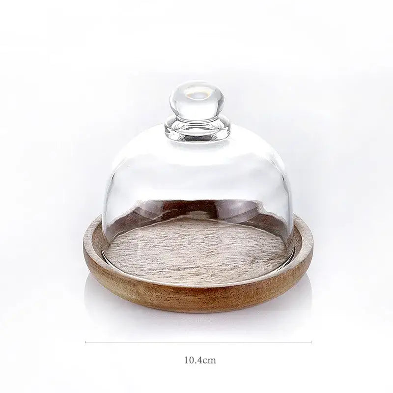 Clear glass dome with rounded knob handle resting on a wooden base for 3 tier glass food storage containers kitchen organizer