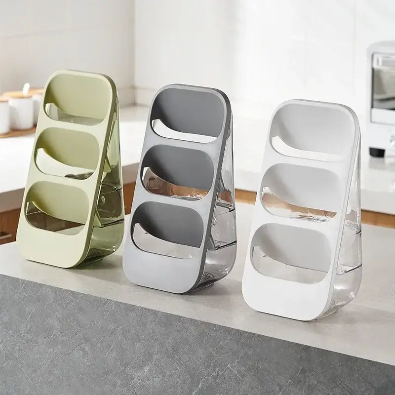 Three modern 3-tier cutlery racks in sage green gray and white with transparent bases for kitchen utensil organization
