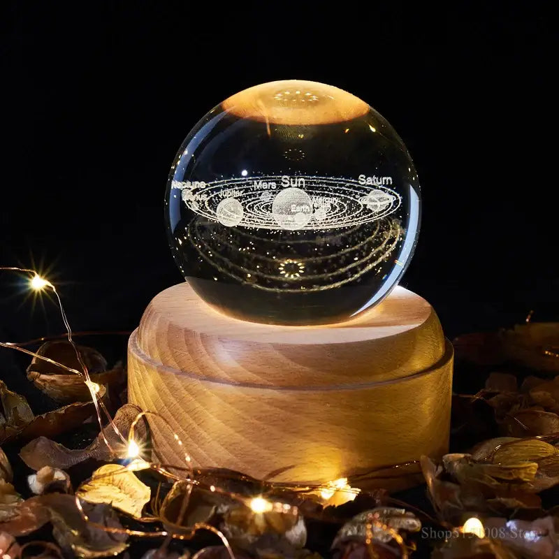 A clear illuminated crystal ball night light with engraved solar system for bedroom decorbites crystal ball music box