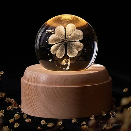 Glowing glass crystal ball night light with golden four-leaf clover on light wooden base for bedroom decorbites crystal ball