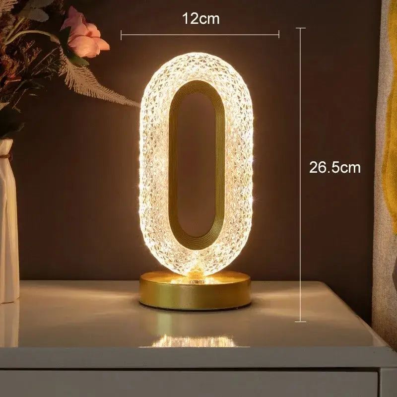 A glowing oval-shaped led lamp with a gold base and crystal mesh design featuring touch dimming night light function