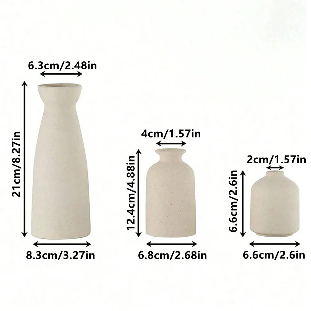 Set of three minimalist off-white ceramic vases with smooth matte finish for modern bohemian farmhouse decor