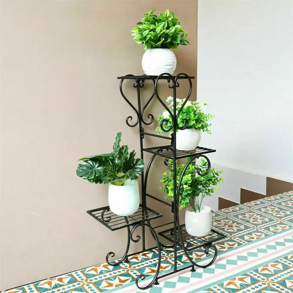 Black wrought iron metal plant stand with ornate scrollwork design from decorbites 4-tier indoor outdoor display