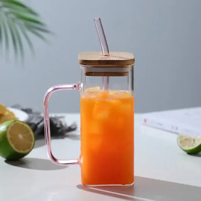 400ml square glass mug with bamboo lid and pink handle filled with orange iced drink for dining room use