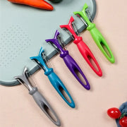 Set of five colorful stainless steel vegetable peelers with ergonomic plastic handles in gray blue purple red and green